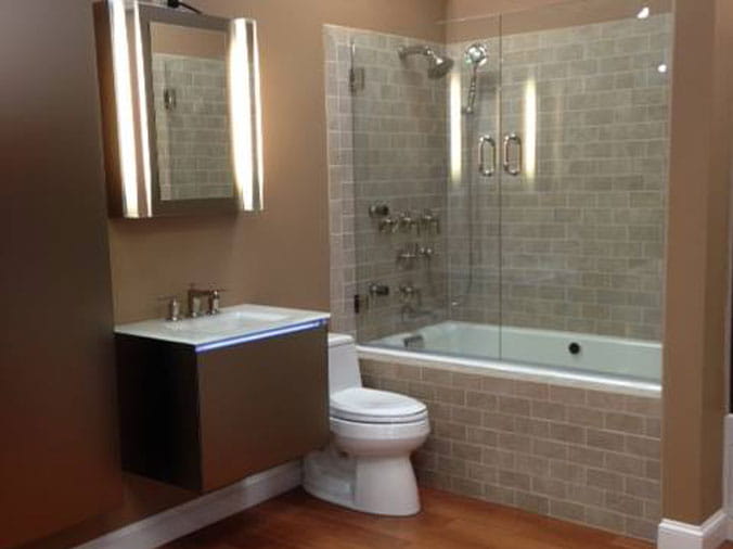 Bthroom with glass shower stall and tile walls