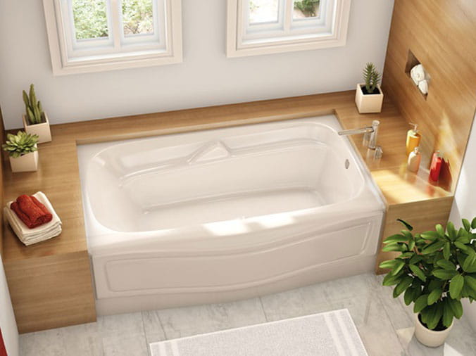 Large bathrub with wood trim surrounding