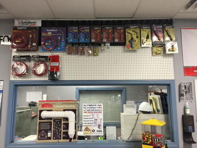 Tools and torches behind the counter at Peabody Supply Watham MA